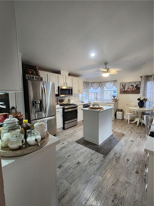 Dining room, Interior, Kitchen, Recessed Lighting, Stainless Steel Appliances, Wood Texture Flooring