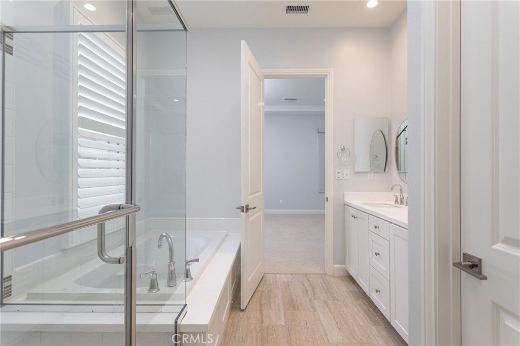 Bathroom, Dual Sink Vanities, Glass Shower, Interior, Recessed Lighting, Wood Texture Flooring