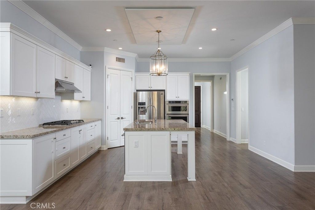 Chandelier, Interior, Kitchen, Pendant Lights, Recessed Lighting, Stainless Steel Appliances, Wood Texture Flooring