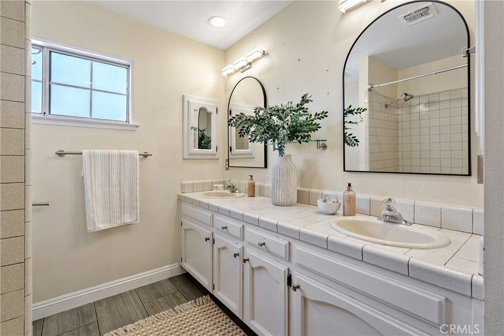 Bathroom, Dual Sink Vanities, Interior, Recessed Lighting, Tile Countertops, Wood Texture Flooring