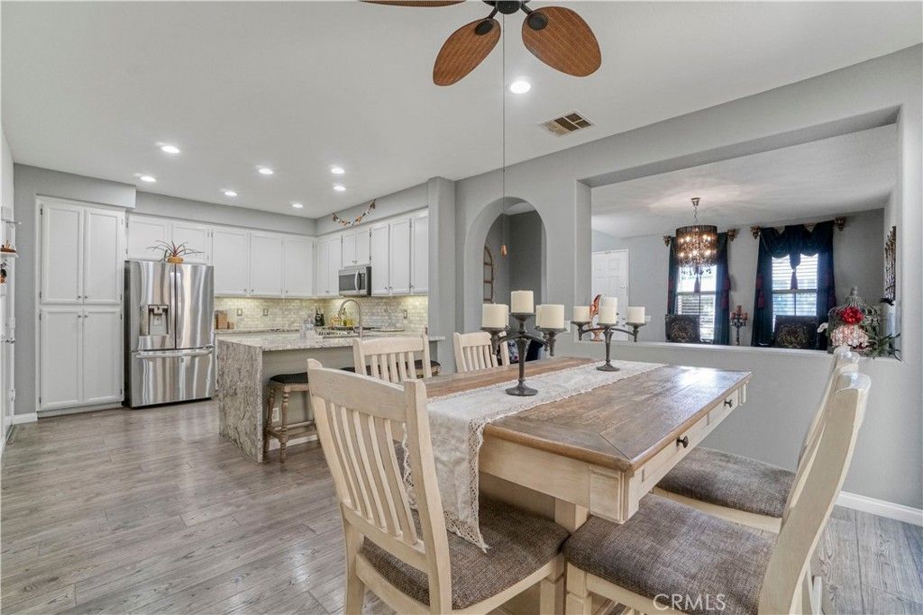 Chandelier, Dining room, Interior, Kitchen, Pendant Lights, Recessed Lighting, Stainless Steel Appliances, Wood Texture Flooring
