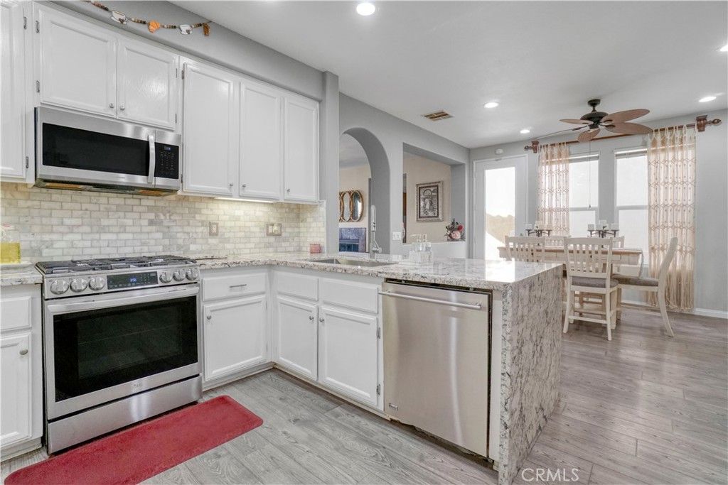 Dining room, Interior, Kitchen, Recessed Lighting, Stainless Steel Appliances, Wood Texture Flooring