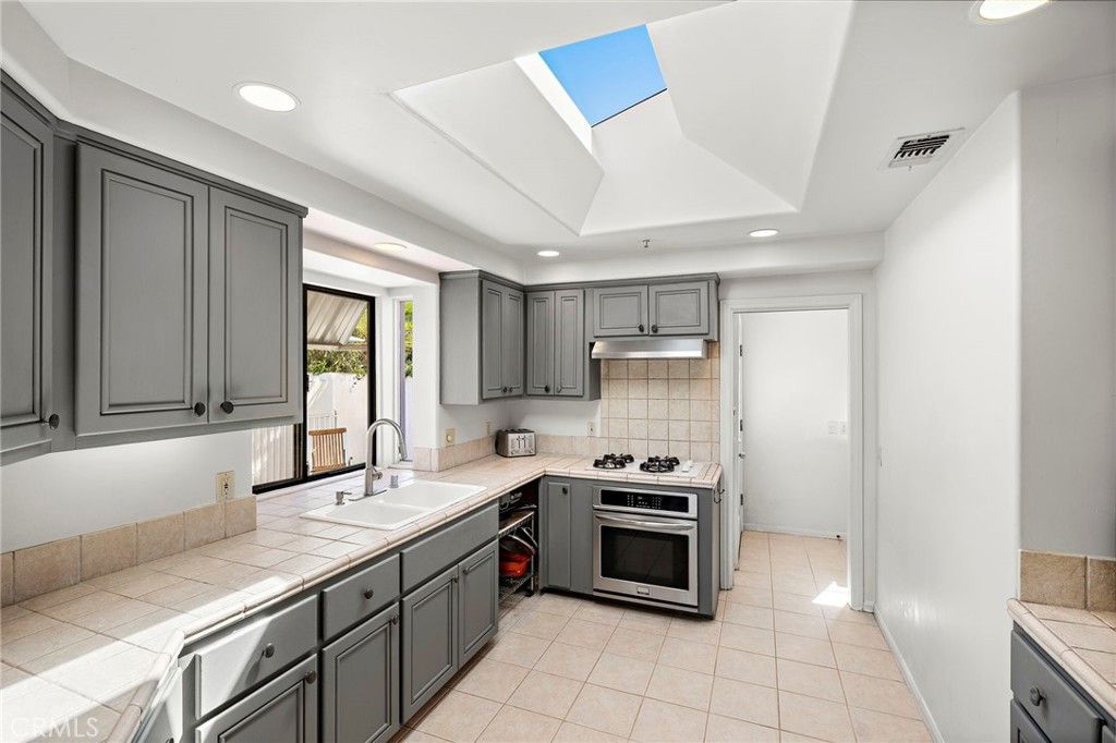 Interior, Kitchen, Recessed Lighting, Stainless Steel Appliances, Tile Countertops