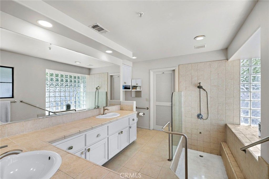 Bathroom, Dual Sink Vanities, Glass Shower, Interior, Recessed Lighting, Tile Countertops