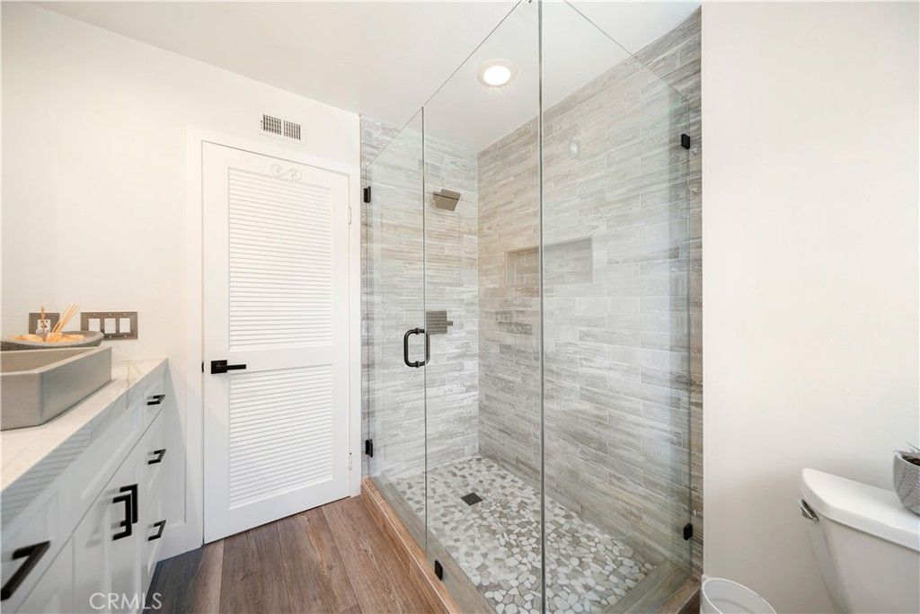 Bathroom, Glass Shower, Interior, Recessed Lighting, Tile Countertops, Wood Texture Flooring