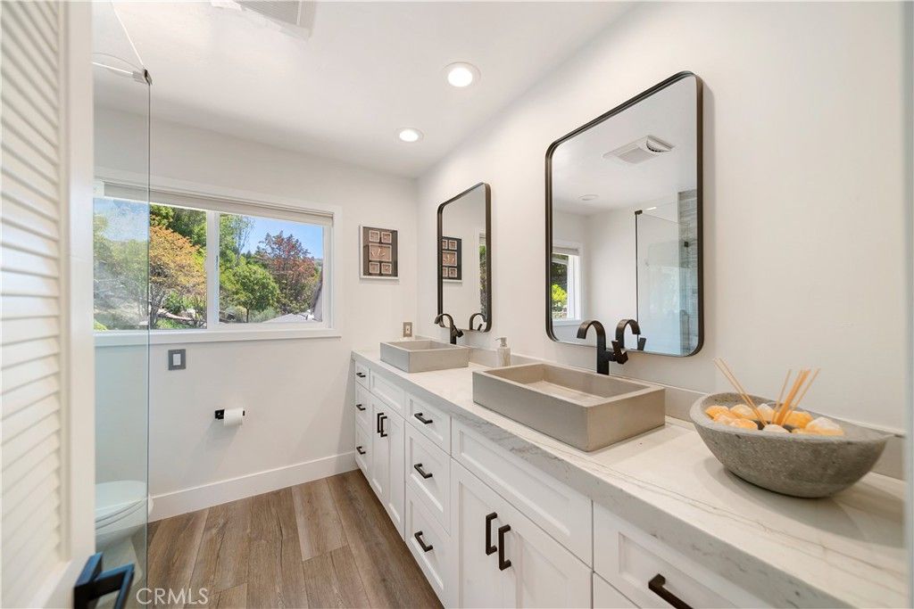 Bathroom, Dual Sink Vanities, Glass Shower, Interior, Recessed Lighting, Wood Texture Flooring