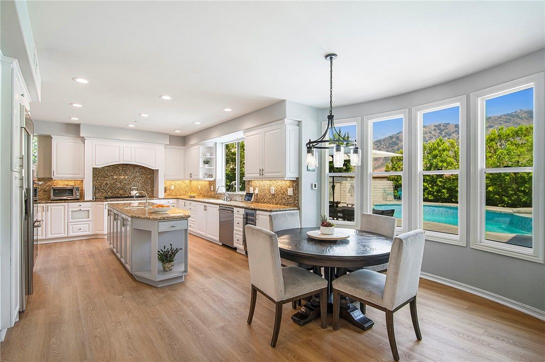 Dining room, Interior, Kitchen, Pendant Lights, Recessed Lighting, Stainless Steel Appliances, Wood Texture Flooring