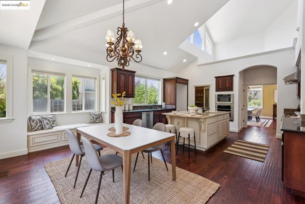 Chandelier, Dining room, Interior, Kitchen, Recessed Lighting, Stainless Steel Appliances, Wood Texture Flooring