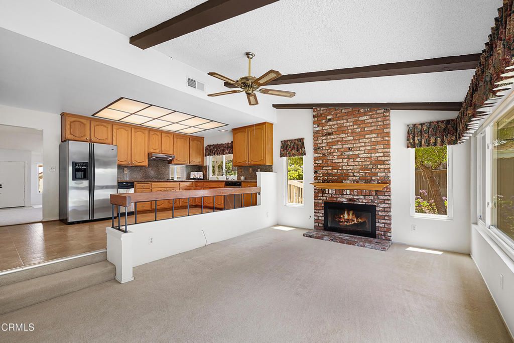 Empty room, Fireplace, Interior, Kitchen, Stainless Steel Appliances, Stone Walls, Wooden Beams