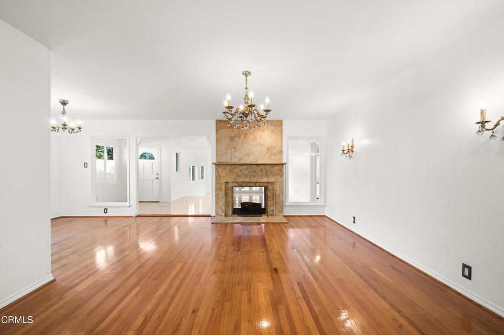 Chandelier, Empty room, Fireplace, Interior, Wood Texture Flooring