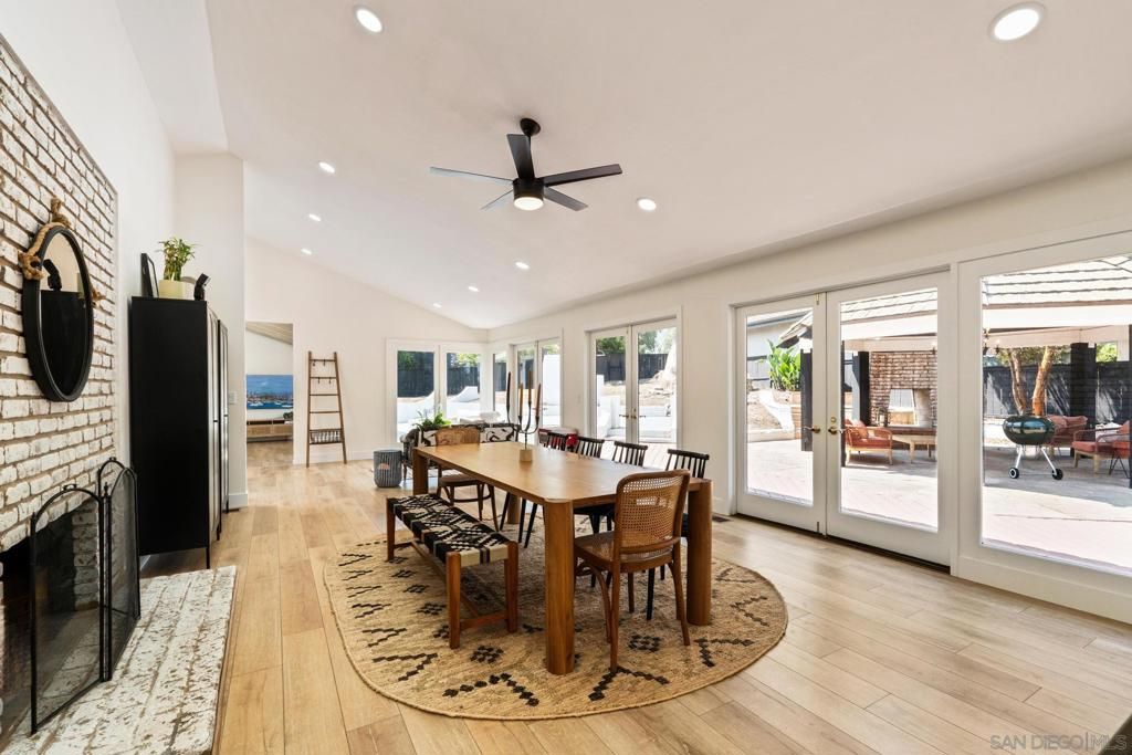 Dining room, Fireplace, Interior, Recessed Lighting, Stone Walls, Wood Texture Flooring