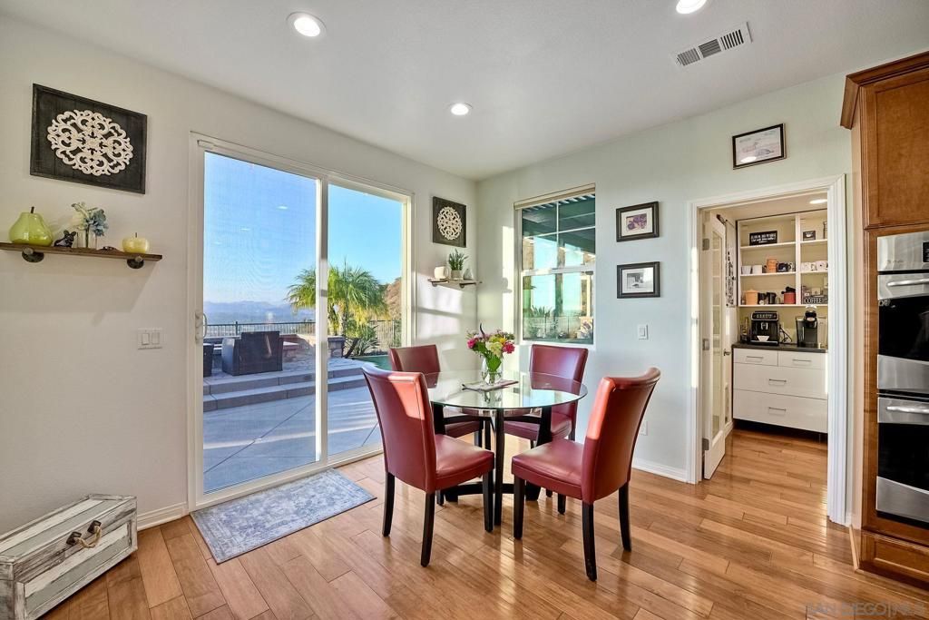 Dining room, Interior, Kitchen, Recessed Lighting, Stainless Steel Appliances, Wood Texture Flooring