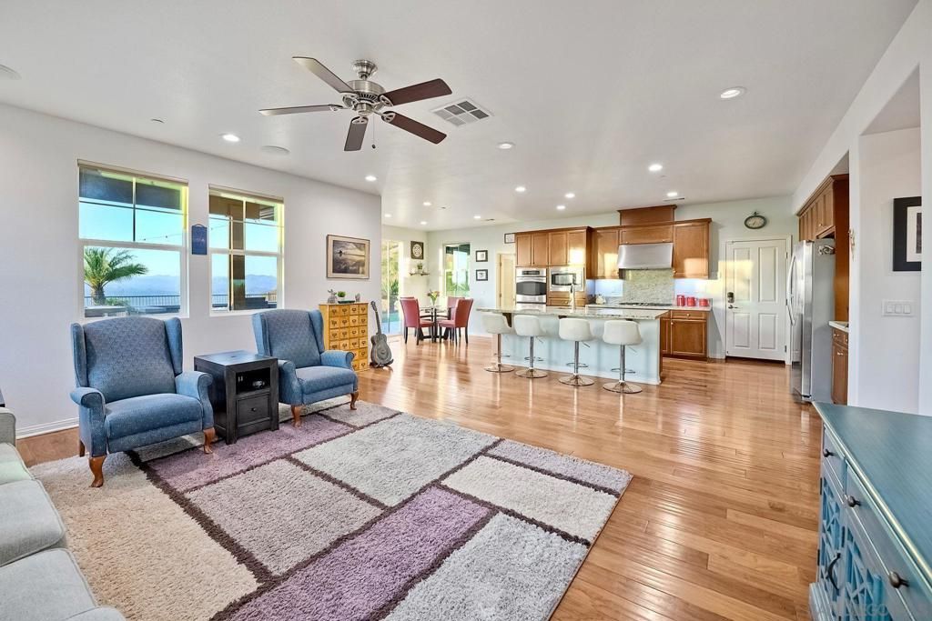 Dining room, Interior, Kitchen, Living room, Recessed Lighting, Stainless Steel Appliances, Water, Wood Texture Flooring