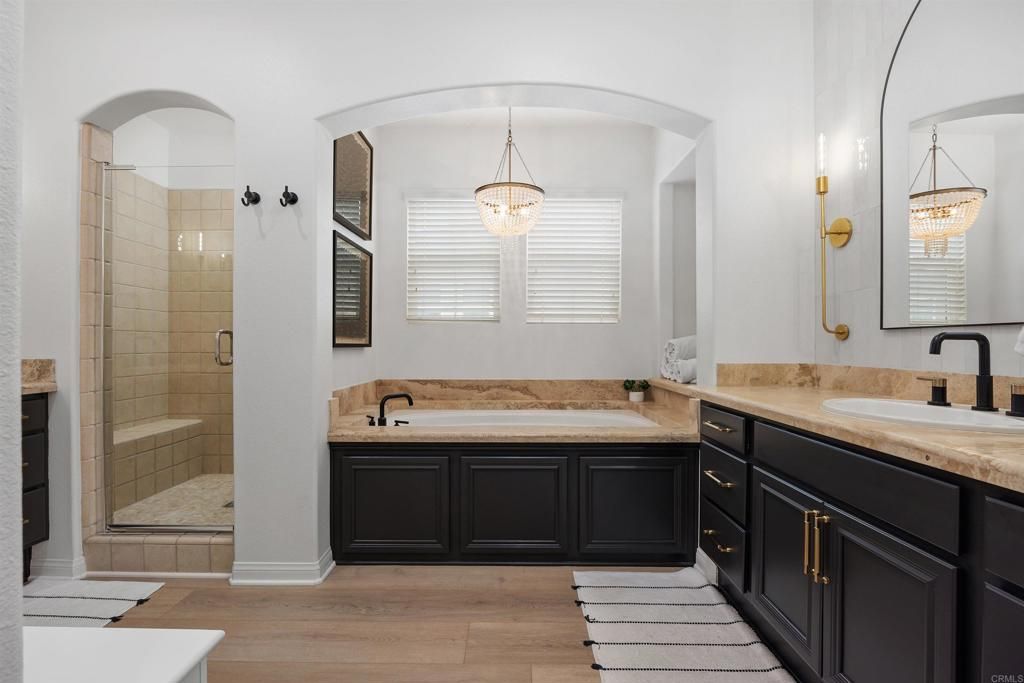 Bathroom, Chandelier, Dual Sink Vanities, Glass Shower, Interior, Pendant Lights, Wood Texture Flooring