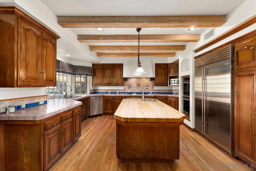 Interior, Kitchen, Pendant Lights, Recessed Lighting, Stainless Steel Appliances, Tile Countertops, Wooden Beams, Wood Texture Flooring