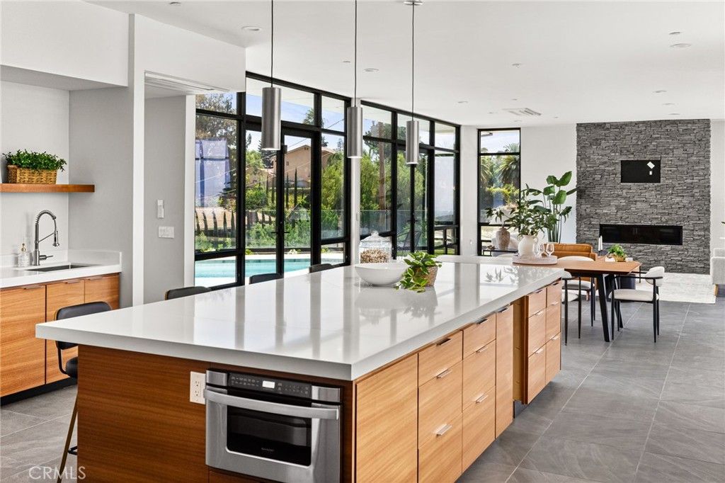 Dining room, Fireplace, Interior, Kitchen, Pendant Lights, Recessed Lighting, Stainless Steel Appliances, Stone Walls