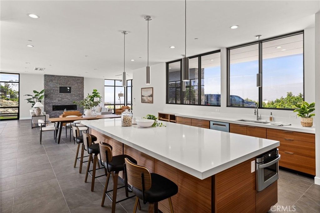 Dining room, Fireplace, Interior, Kitchen, Pendant Lights, Recessed Lighting, Stainless Steel Appliances, Stone Walls