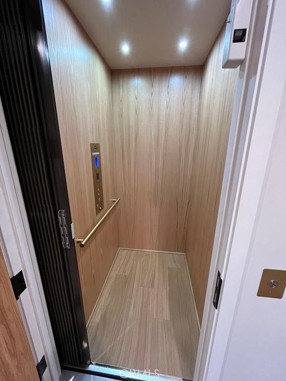 Elevator, Interior, Recessed Lighting, Wood Texture Flooring, Wooden Walls