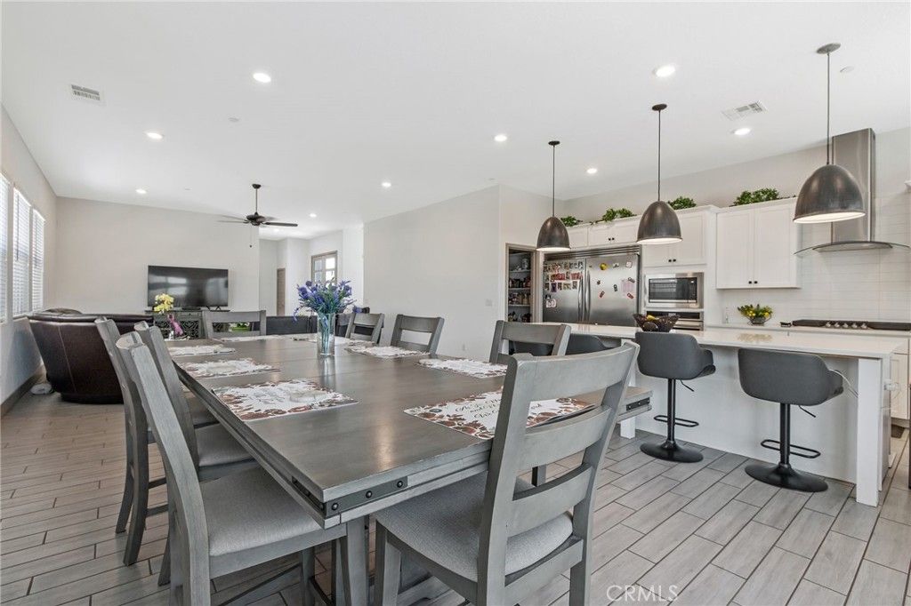 Dining room, Interior, Kitchen, Pendant Lights, Recessed Lighting, Stainless Steel Appliances, Wood Texture Flooring
