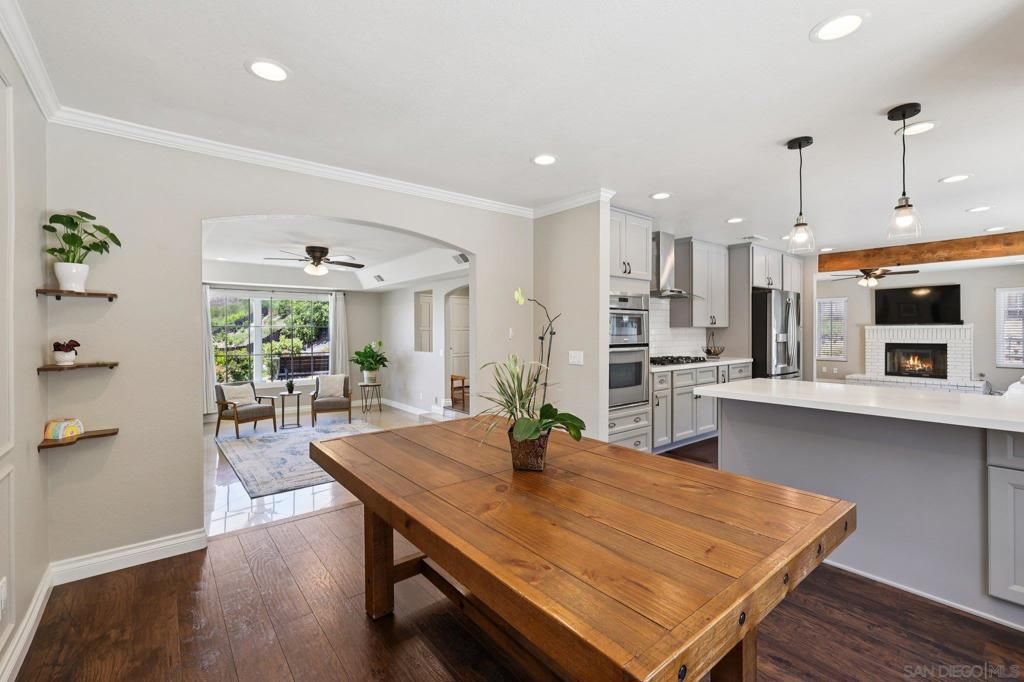 Dining room, Fireplace, Interior, Kitchen, Pendant Lights, Recessed Lighting, Stainless Steel Appliances, Wood Texture Flooring