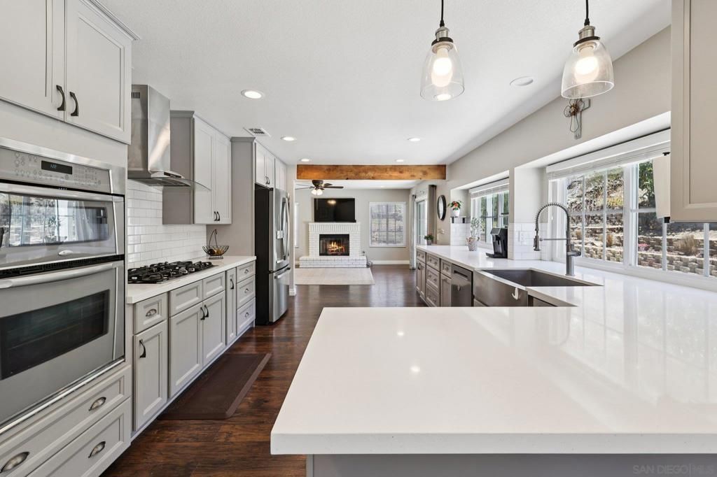 Fireplace, Interior, Kitchen, Pendant Lights, Recessed Lighting, Stainless Steel Appliances, Wood Texture Flooring
