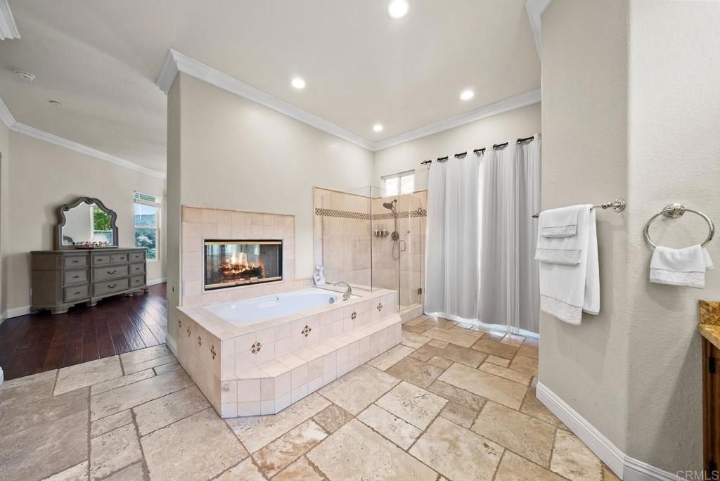 Bathroom, Fireplace, Glass Shower, Interior, Recessed Lighting, Wood Texture Flooring