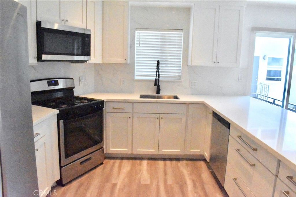 Interior, Kitchen, Marble Walls, Stainless Steel Appliances, Wood Texture Flooring