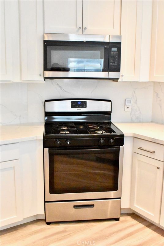 Interior, Kitchen, Marble Walls, Stainless Steel Appliances, Wood Texture Flooring