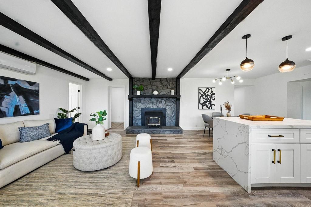 Dining room, Fireplace, Interior, Living room, Pendant Lights, Recessed Lighting, Wooden Beams, Wood Texture Flooring