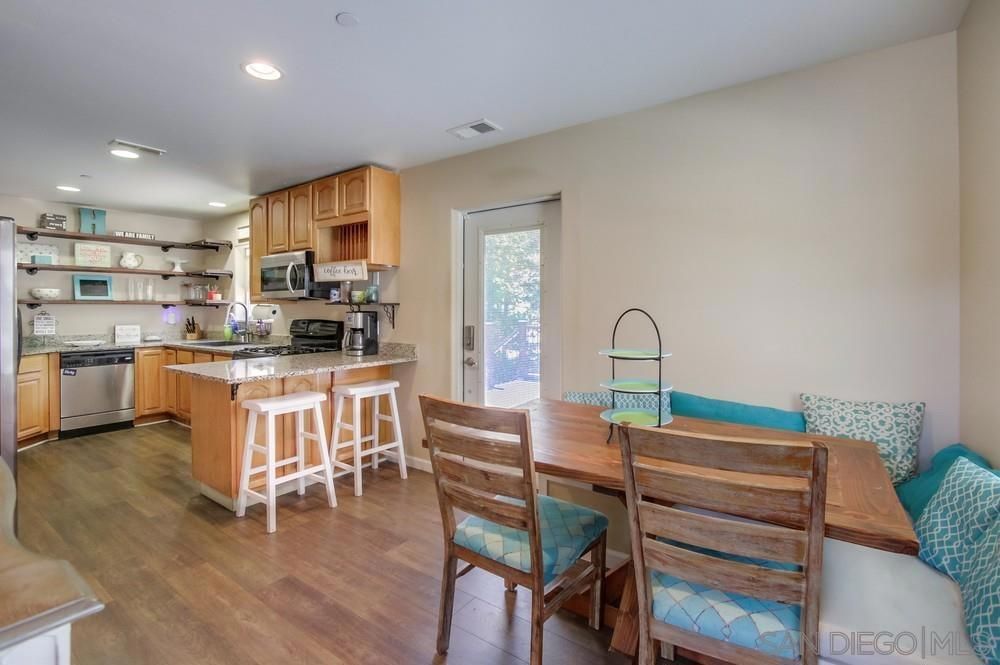 Dining room, Interior, Kitchen, Recessed Lighting, Stainless Steel Appliances, Wood Texture Flooring