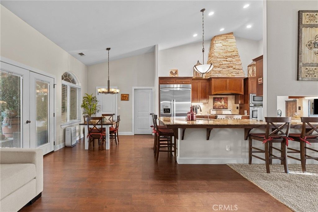 Chandelier, Dining room, Interior, Kitchen, Pendant Lights, Recessed Lighting, Stainless Steel Appliances, Wood Texture Flooring