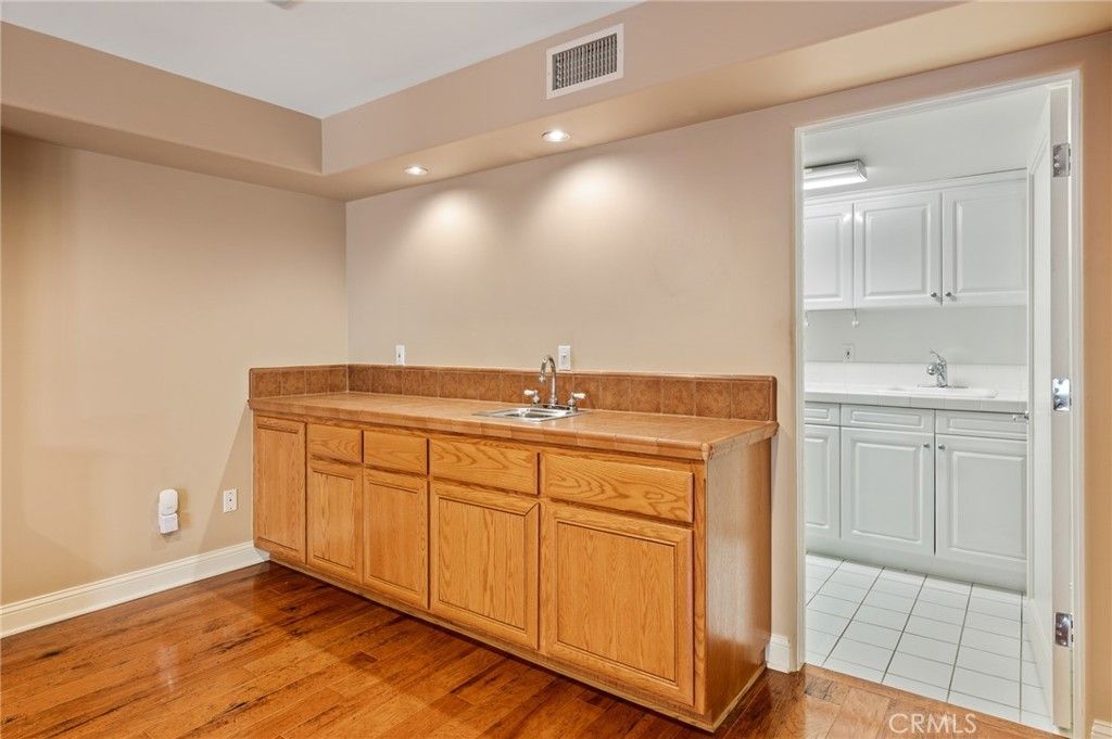 Bathroom, Dual Sink Vanities, Interior, Recessed Lighting, Wood Texture Flooring