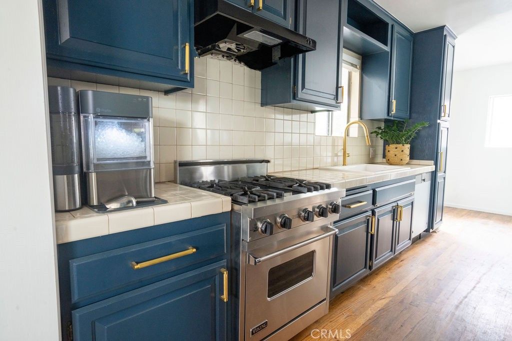 Interior, Kitchen, Stainless Steel Appliances, Tile Countertops, Wood Texture Flooring