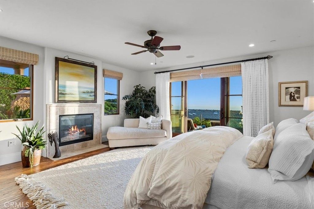 Bedroom, Fireplace, Interior, Recessed Lighting, Water, Wood Texture Flooring