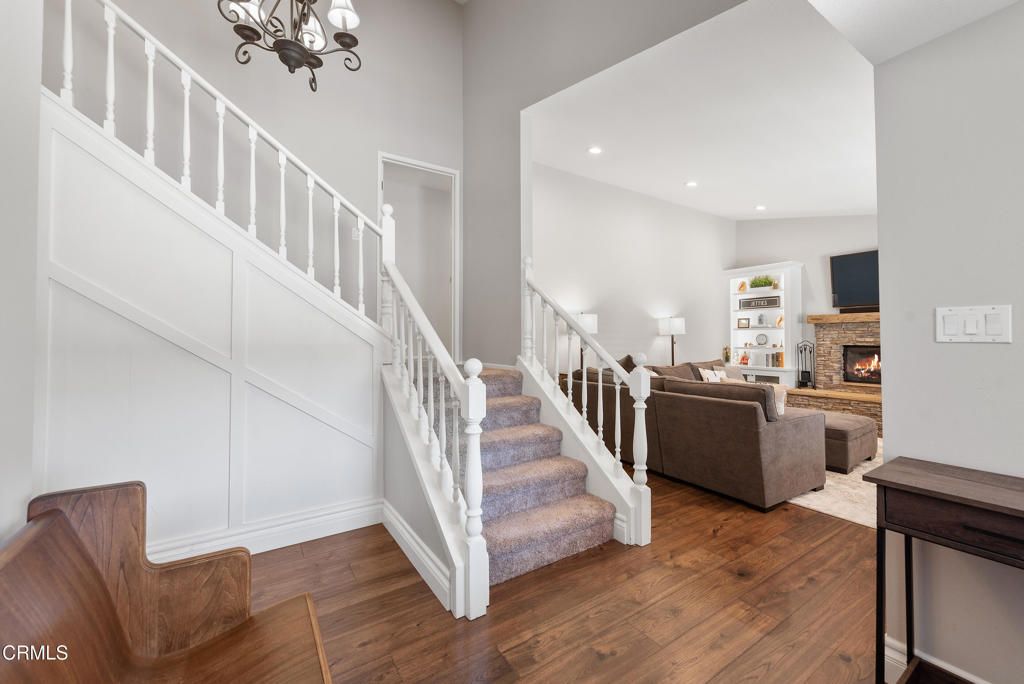 Chandelier, Fireplace, Interior, Living room, Recessed Lighting, Wood Texture Flooring