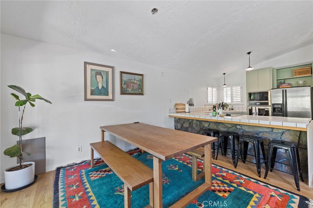 Dining room, Interior, Kitchen, Pendant Lights, Stainless Steel Appliances, Tile Countertops, Wood Texture Flooring