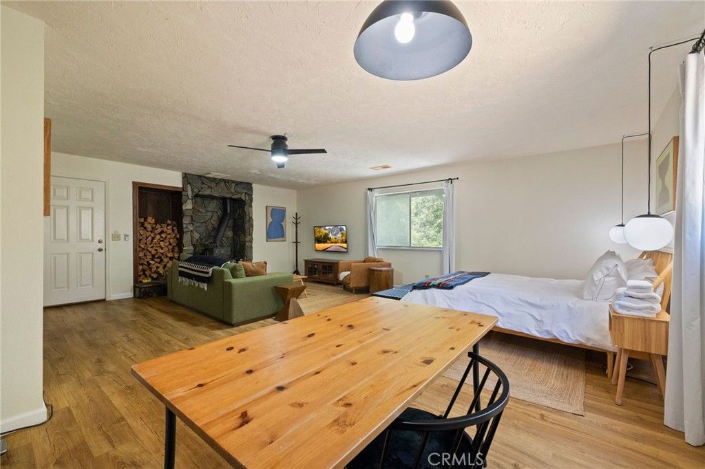 Bedroom, Dining room, Fireplace, Interior, Wood Texture Flooring