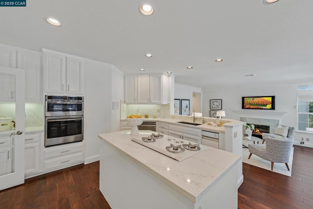 Fireplace, Interior, Kitchen, Living room, Recessed Lighting, Stainless Steel Appliances, Wood Texture Flooring