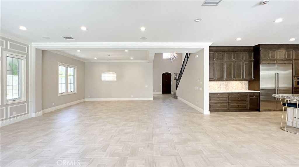 Empty room, Interior, Kitchen, Pendant Lights, Recessed Lighting, Stainless Steel Appliances, Wood Texture Flooring