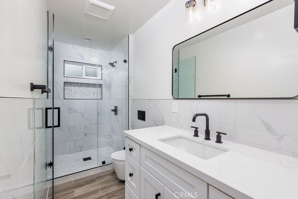 Bathroom, Glass Shower, Interior, Marble Walls, Wood Texture Flooring