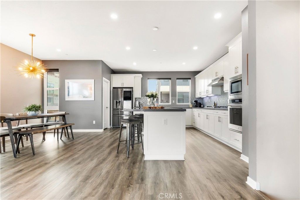 Dining room, Interior, Kitchen, Pendant Lights, Recessed Lighting, Stainless Steel Appliances, Wood Texture Flooring