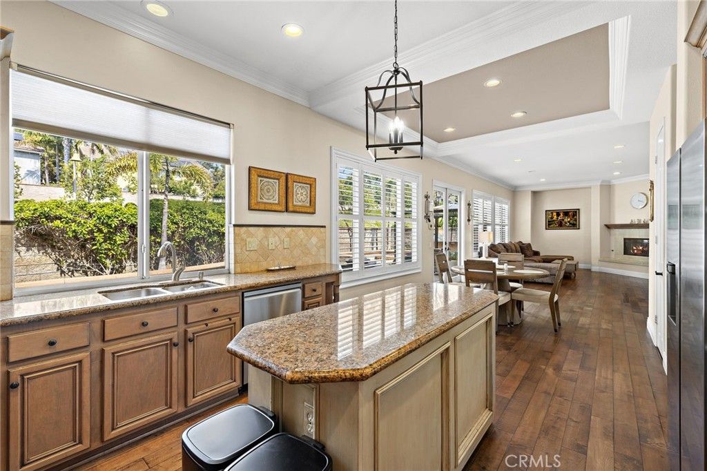 Dining room, Fireplace, Interior, Kitchen, Pendant Lights, Recessed Lighting, Stainless Steel Appliances, Wood Texture Flooring