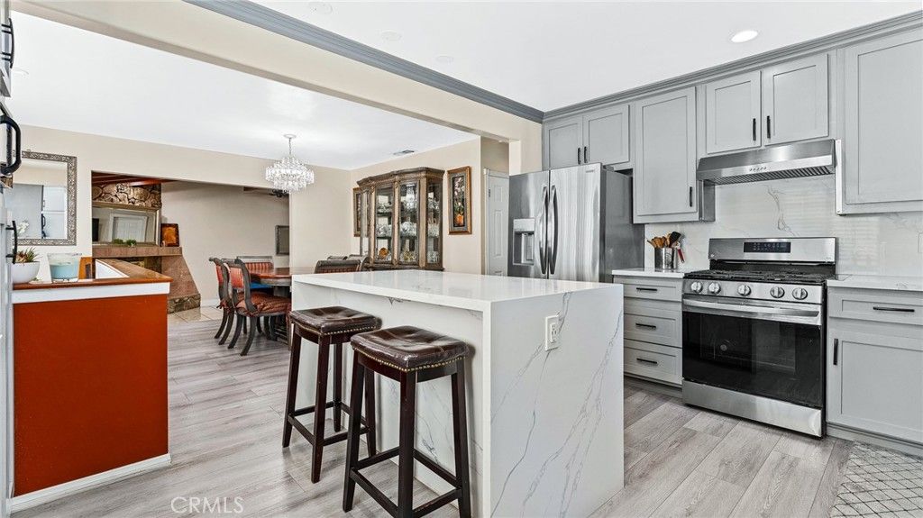 Chandelier, Dining room, Interior, Kitchen, Recessed Lighting, Stainless Steel Appliances, Wood Texture Flooring