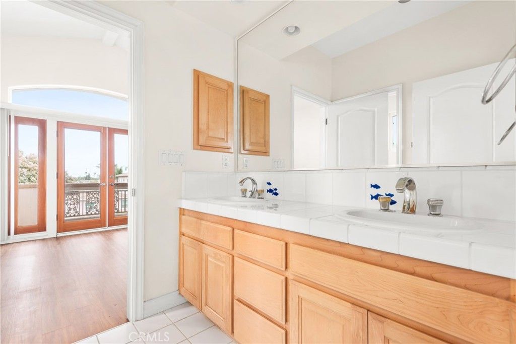 Bathroom, Dual Sink Vanities, Interior, Recessed Lighting, Tile Countertops, Wood Texture Flooring