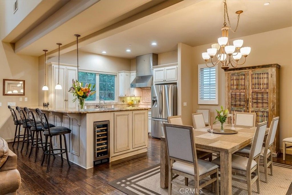 Chandelier, Dining room, Interior, Kitchen, Pendant Lights, Recessed Lighting, Stainless Steel Appliances, Wood Texture Flooring