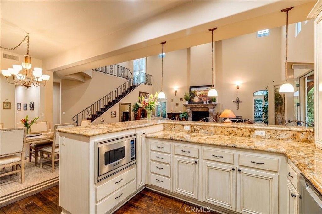 Chandelier, Dining room, Fireplace, Interior, Kitchen, Pendant Lights, Wood Texture Flooring
