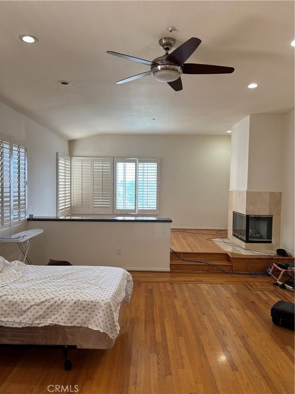 Bedroom, Fireplace, Interior, Recessed Lighting, Wood Texture Flooring