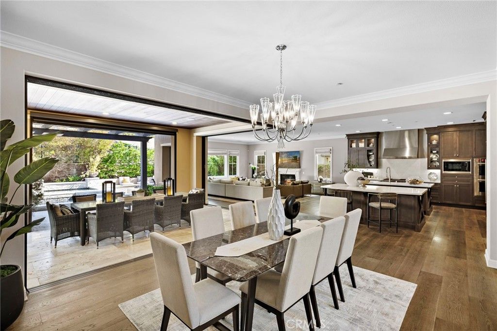Chandelier, Dining room, Interior, Kitchen, Living room, Recessed Lighting, Stainless Steel Appliances, Wood Texture Flooring