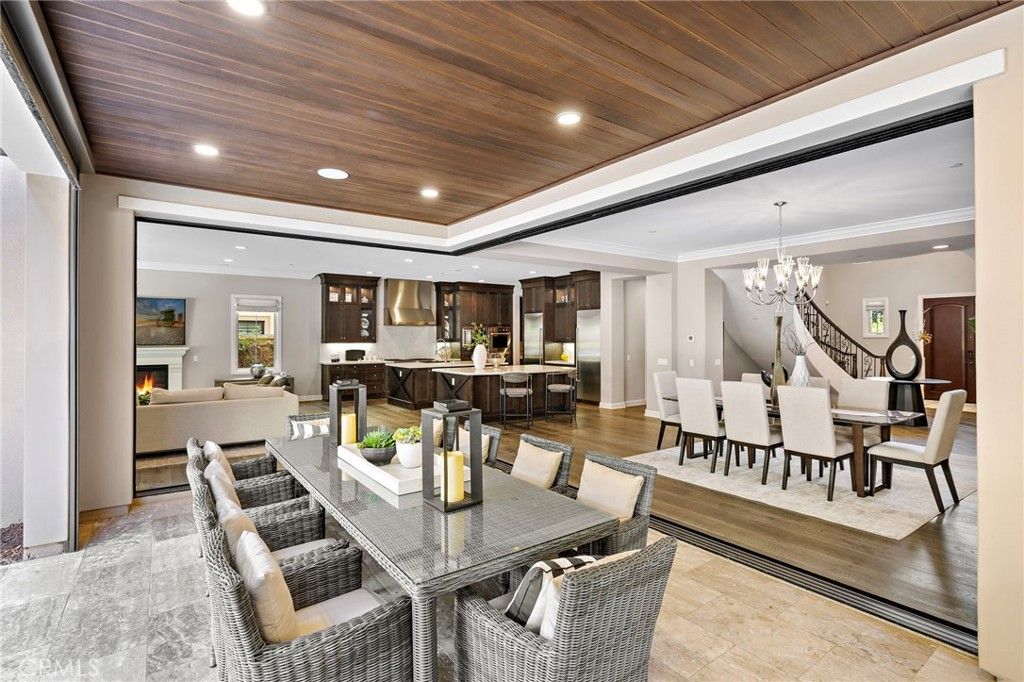 Chandelier, Dining room, Fireplace, Interior, Kitchen, Living room, Recessed Lighting, Wooden Ceilings, Wood Texture Flooring