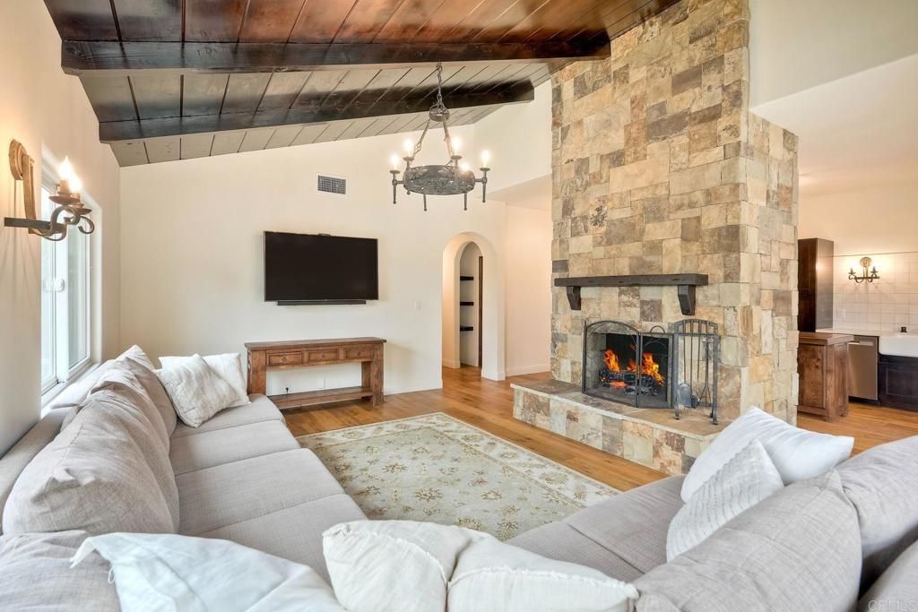 Chandelier, Fireplace, Interior, Living room, Stone Walls, Wooden Beams, Wooden Ceilings, Wood Texture Flooring